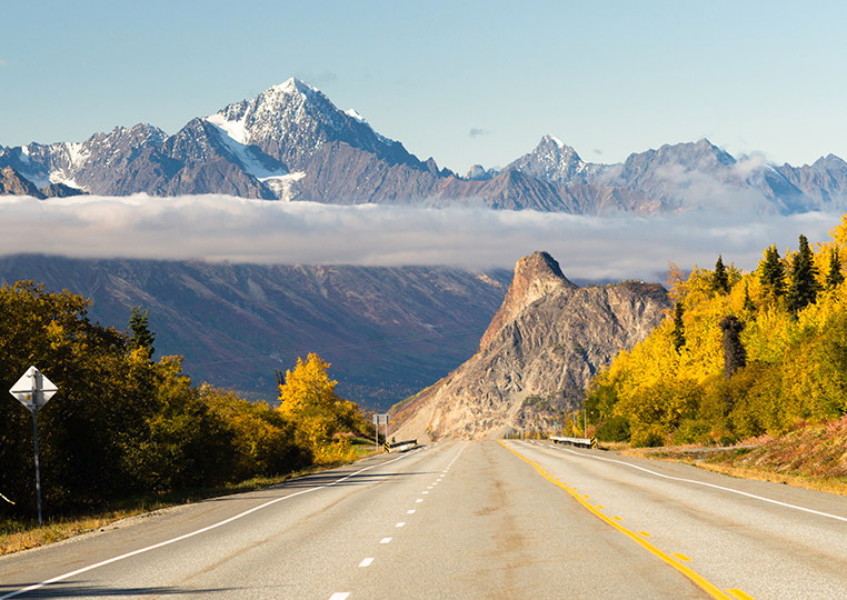 open-road-with-mountains-and-trees